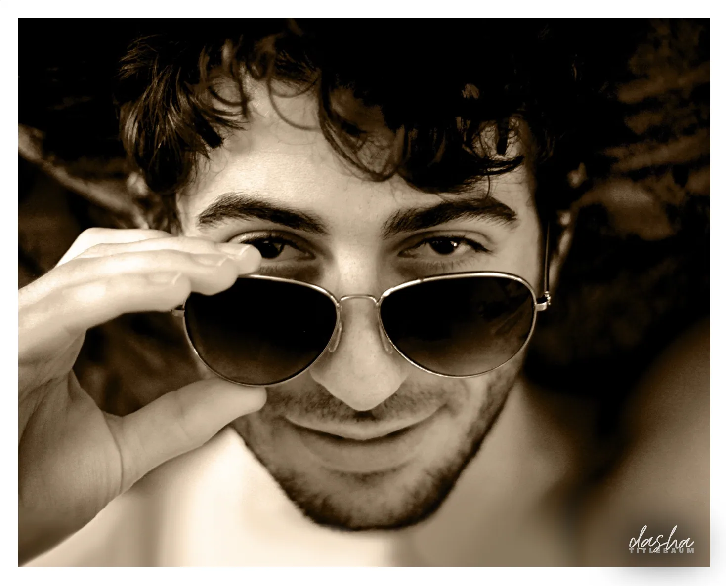 Ari Portrait Study, Black and white portrait with dramatic lighting and vintage sunglasses styling.